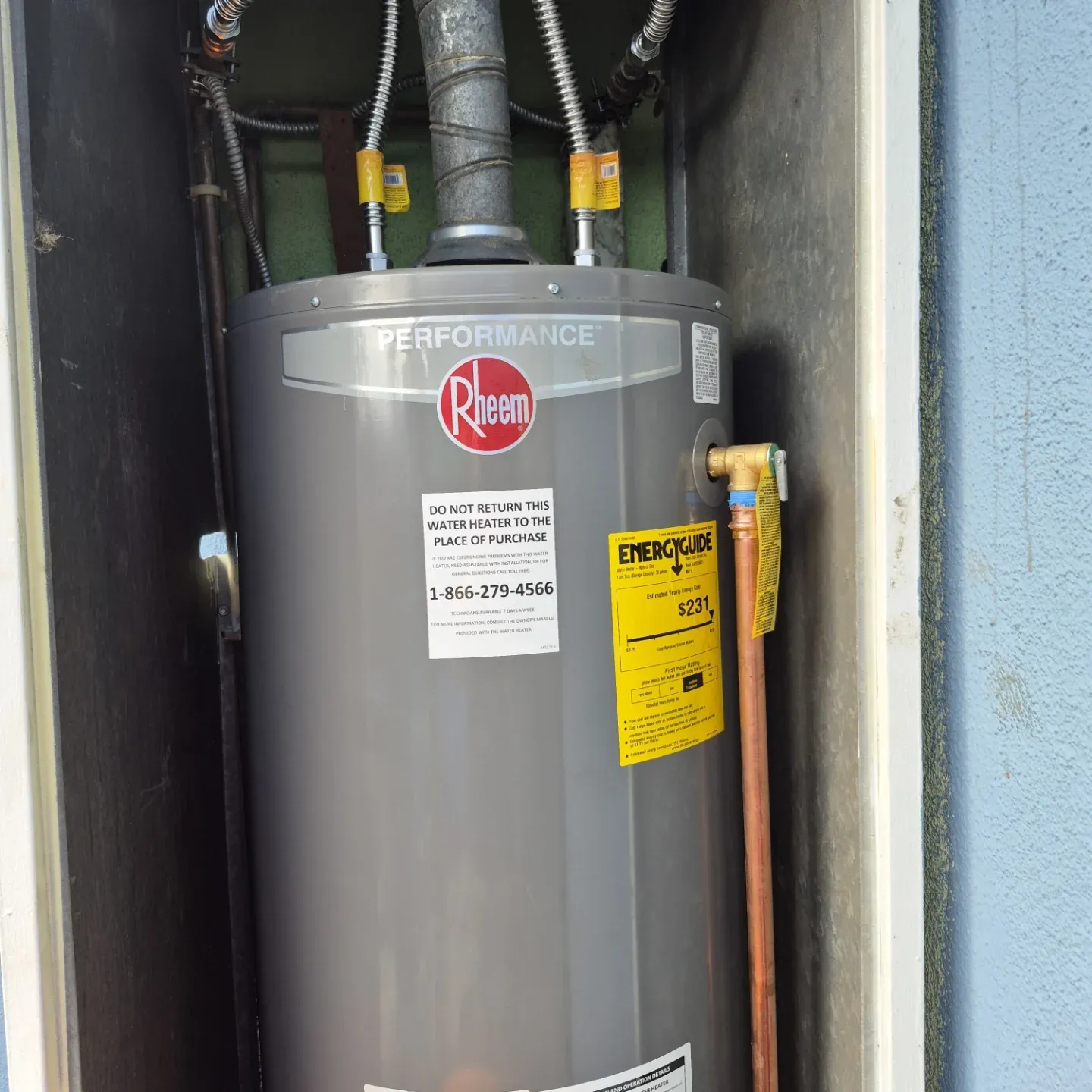 New Rheem Performance tank water heater in the tight space